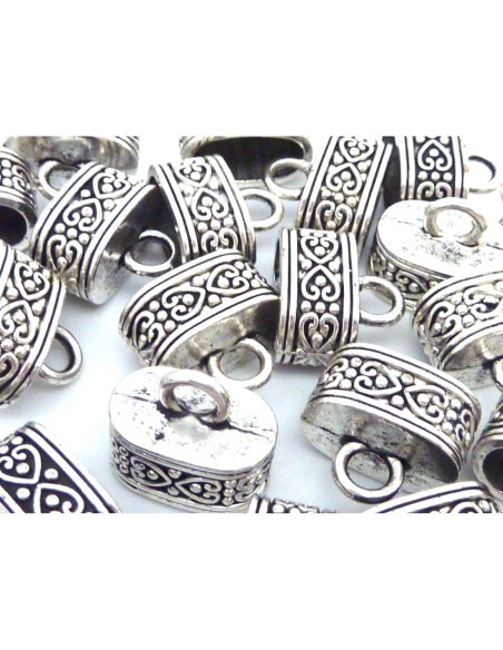 Embout ovale argenté en métal travaillé motif coeur