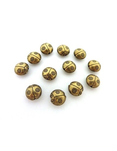 perle coccinelle en metal de couleur bronze