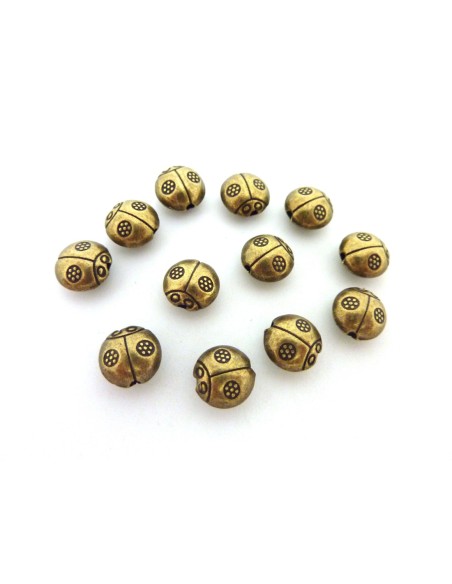 perle coccinelle en metal de couleur bronze
