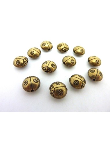 perle coccinelle en metal de couleur bronze
