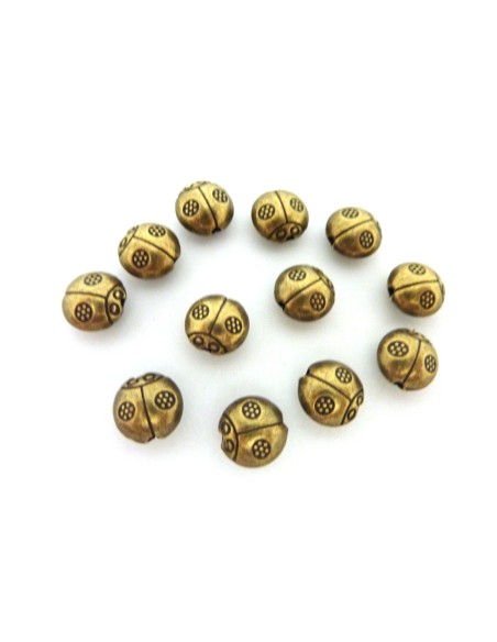 perle coccinelle en metal de couleur bronze