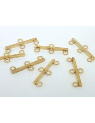 Embout  trous en métal doré 