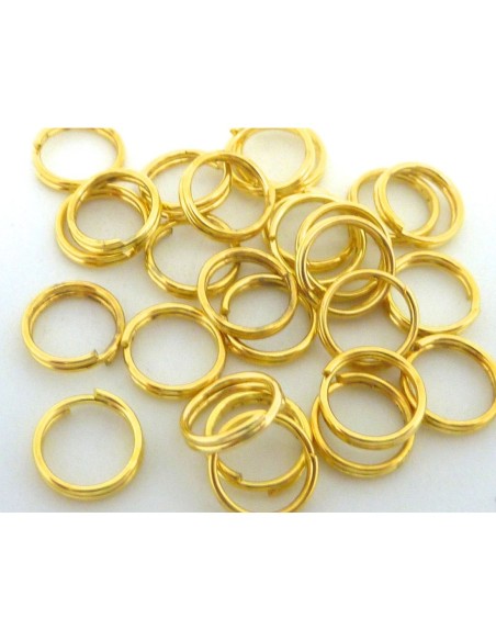 R-10g - environ 110 anneaux de jonction double 7mm en métal doré