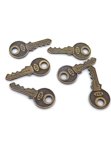 Breloque clef de couleur bronze en métal