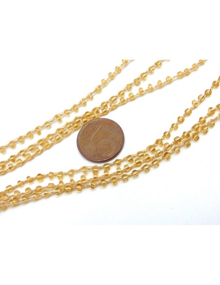 1m de chaînette de rocaille  de couleur doré transparent sur fil de nylon tressé, rocailles en verre 2,3mm