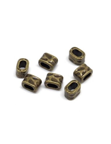 Perle poussoir pour lanière cuir de 5mm martelé en métal de couleur bronze