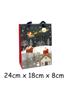 Pochette cadeau papier cartonné glacé motif village de nuit enneigé et Père Noël dans son traineau doré, rouge sur fond noir