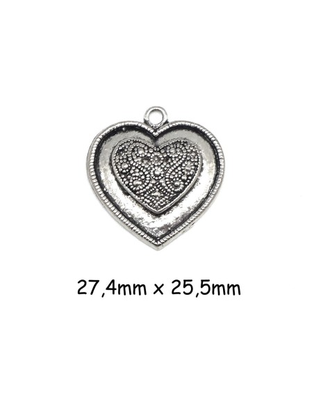 Pendentif coeur en métal argenté travaillé style ethnique