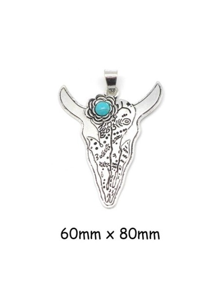 Grand breloque tête de buffle avec fleur en métal argenté et pierre bleu turquoise Grand breloque tête de buffle avec fleur en métal argenté et pierre bleu turquoise