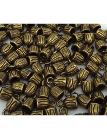 Embout rond pour cordon de 3mm en métal couleur bronze strié Embout rond pour cordon de 3mm en métal couleur bronze strié