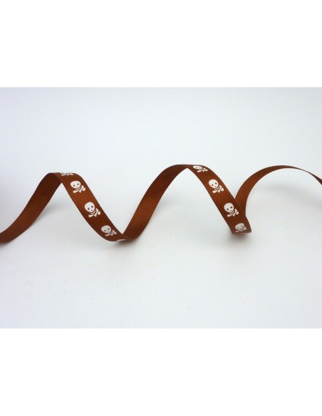 Galon fantaisie avec tête de mort blanche sur fond marron