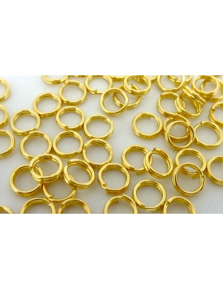 R-5g - Environ 75 anneaux de jonction double 5mm en métal doré