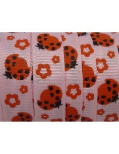 Ruban motif coccinelle rouge sur fond rose