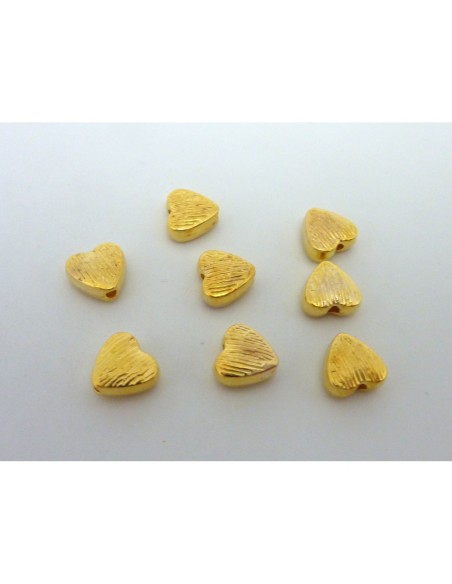 perle coeur strié en métal doré