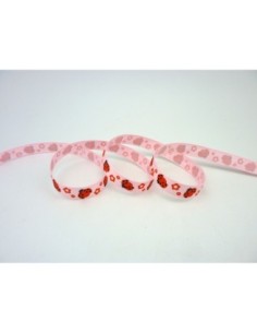 Ruban motif coccinelle rouge sur fond rose 2
